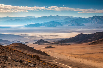 Fototapeta premium Breathtaking desert landscape with mountains and valleys under clear sky