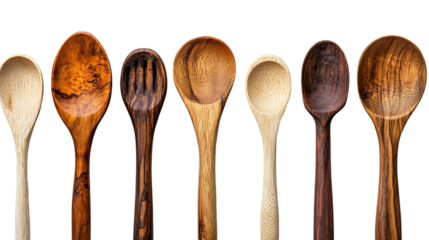 Handcrafted wooden spoon isolated on transparent background for culinary arts and rustic kitchen design projects featuring natural utensils and organic cooking tools.