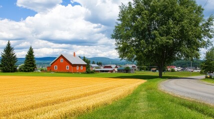 A vibrant red house stands prominently in a vast field of golden wheat, showcasing a serene rural landscape under clear skies.