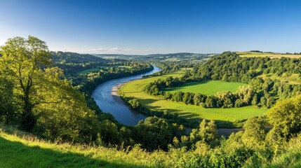 lush greenery and winding river against a clear blue sky