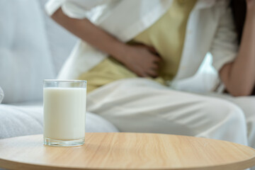 Milk allergens, Sick sad unhealthy ill allergic woman, runny stuffy sore nose suffer from intolerance allergy trigger symptoms. abdominal pain, allergens, nut protein, rash, death, food allergy