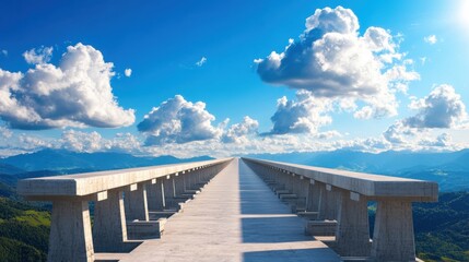 Long bridge with benches over an empty concrete expanse under a clear blue sky