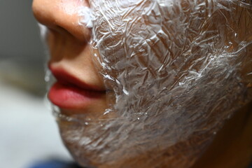 white facial anesthesia cream on face skin of asia woman