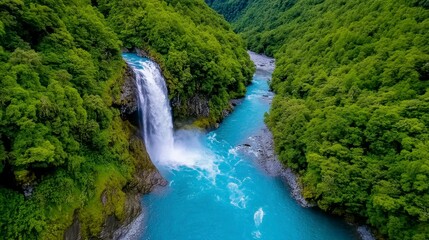 Obraz premium Stunning Waterfall Surrounded by Lush Green Forest Landscape