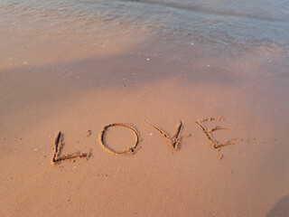 Love etched sand beach setting serene environment close-up view romantic concept