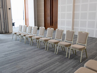 Empty chairs await guests at conference room modern venue interior design calm atmosphere