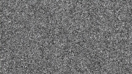 High-resolution image of dark gray gravel. Ideal for backgrounds, textures, or website design elements needing a rough, granular aesthetic.