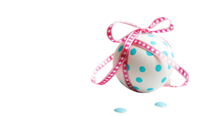 Decorated easter egg wrapped with pink ribbon on transparent background