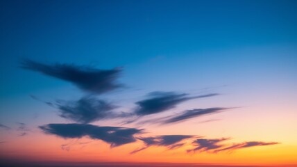 Obraz premium Twilight Sky Canvas: Dramatic skyscape in the evening with clouds. It is the painting of sky with a palette of vibrant colors and dynamic cloud formations.