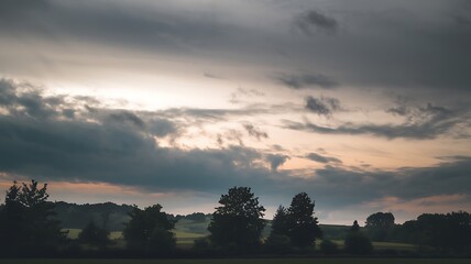 Obraz premium Dramatic Sky over the Horizon: An evocative landscape painting the spectacle of a dramatic, cloud-filled sky meeting a distant horizon. It evokes feelings of awe, mystery, and the sublime.
