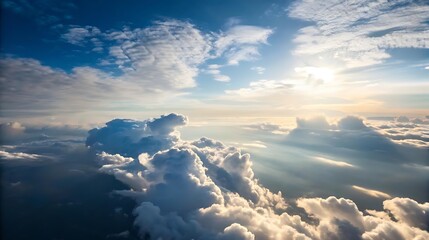 Stunning aerial view of fluffy clouds and sun rays.