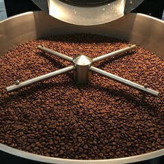 Coffee Beans Roasting in a Large Metal Vat – Premium Arabica and Robusta Blends for Rich Aroma and Flavor