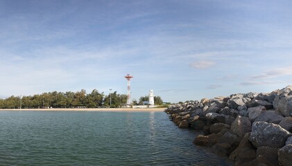 Lighthouse and radar transmitter. On the right is a breakwater