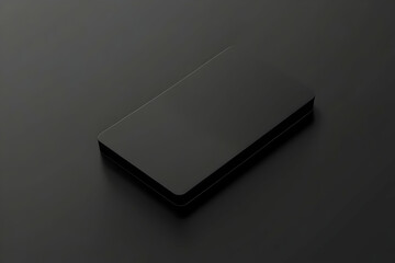 Sleek and Minimalist Black Device on a Dark Surface, A Modern Technology Mockup for Design and Marketing Projects featuring Clean Lines and Subtle Lighting
