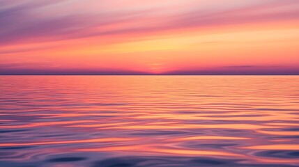Obraz premium The Vivid Sunset Colors Reflecting Beautifully on the Peaceful Water