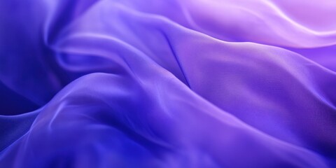 Obraz premium Fluid Dreams: Abstract view of draped fabric, a symphony of soft folds in a vibrant purple and blue, that captures a sense of ethereal beauty and flowing motion