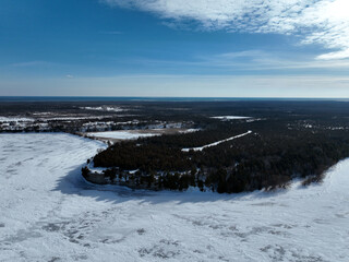 Aerial view of cliffs overlooking an ice-covered Lake Ontario in mid-winter