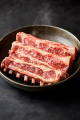 Raw Lamb Chops on Bone in Dark Bowl, Gourmet Meat