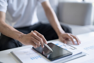 Fototapeta premium Business man working on digital tablet Graphic designer drawing on graphic tablet&nbsp;creative studying work&nbsp;at home