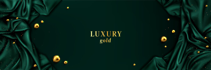 Green gold luxury abstract background with silk fabric draped along edges, metallic balls and golden glitter on emerald surface. Elegant banner design for premium product promotion or invitations.
