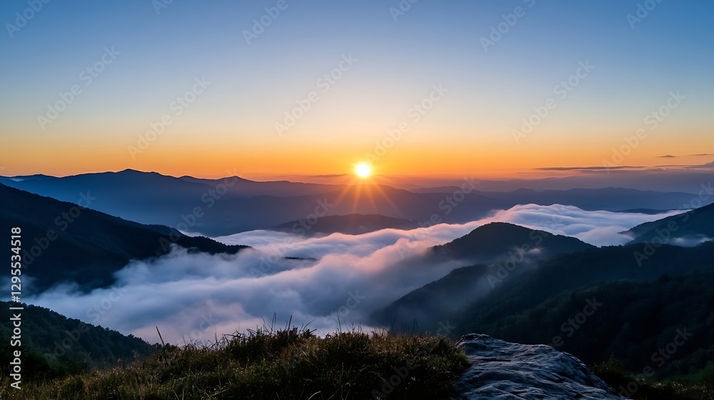 Poster stunning panoramic view of a colorful sunrise illuminating the mountains and clouds in the valley : 