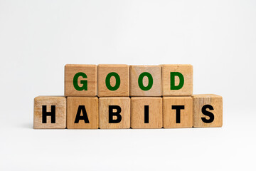 good habits words symbol on wooden blocks isolated on white background. motivational words concept