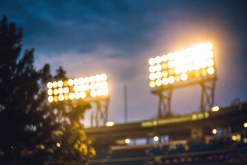 Obraz premium Stadium lights glowing against night sky