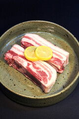 Cooking ingredients for Korean BBQ. Raw Jeju black pork belly.