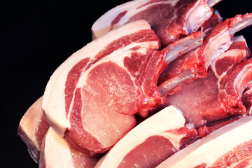 Cooking ingredients for Korean BBQ or pork steak. Uncooked Jeju black pork bone sirloin.