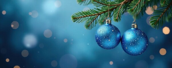 Twinkling blue glass ball ornaments hanging from a branch, ornaments, blue, hangings