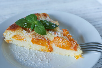 A slice of apricot mint pie on a white plate.