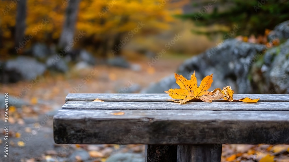Poster vibrant autumn scene featuring a bright orange maple leaf on rustic wooden table : generative ai
