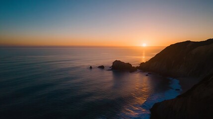 Stunning sunset over the ocean with rocks and calm water reflecting the warm colors of the sky : Generative AI