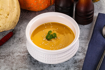Vegan pumpkin cream soup served sesam