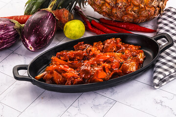 Asian cuisine - pork in chili sauce