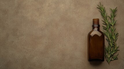 Amber bottle with rosemary on textured background showcasing herbs