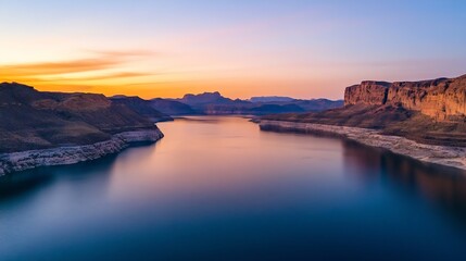Fototapeta premium Breathtaking Aerial View of Tranquil Lake at Sunset with Vibrant Colors and Serene Landscape : Generative AI