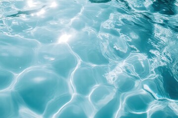 Obraz premium The mesmerizing surface of aqua water reflecting light, presenting an inviting glimpse into a refreshing aquatic world.