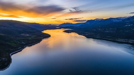 Fototapeta premium Breathtaking Sunset Reflected in a Calm Body of Water Surrounded by Mountains : Generative AI