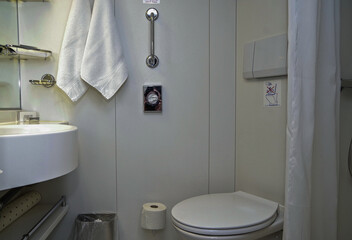 Classic interior design inside bathroom with sink and faucet of cabin stateroom onboard luxury...
