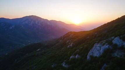 Obraz premium Breathtaking sunset view over a mountainous landscape showcasing dramatic colors of nature : Generative AI