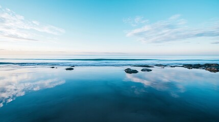 Obraz premium Calm ocean view reflecting the sky with gentle waves and picturesque coastal landscape : Generative AI