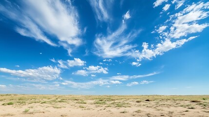 Vast open landscape under a bright blue sky marked by fluffy clouds and dry terrain : Generative AI