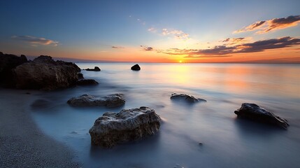 Obraz premium Stunning Sunset Over Calm Ocean with Rocks and Reflections on Water : Generative AI