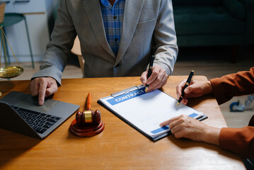 Two lawyers are discussing about contract paper, law matters determination, pointing.law