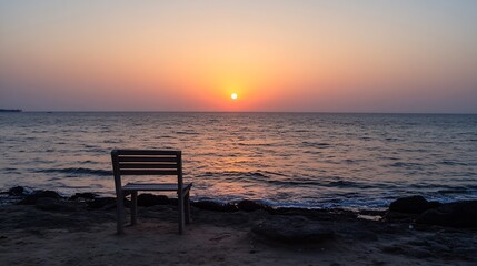 Lonely Chair by the Shore Basking in Sunset Glow On Tranquil Beach : Generative AI