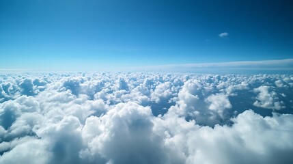 Naklejka premium Vast expanse of fluffy clouds beneath a clear blue sky creating a stunning aerial view : Generative AI