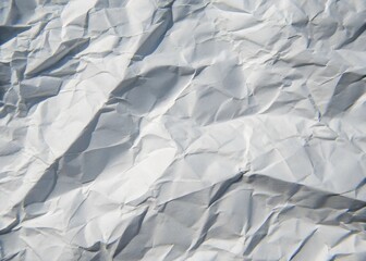 Fototapeta premium Abstract texture of crumpled grey paper with artistic light and shadow play