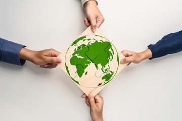 Green business corporate put jigsaw together for sustainable environment development goal. Group of...