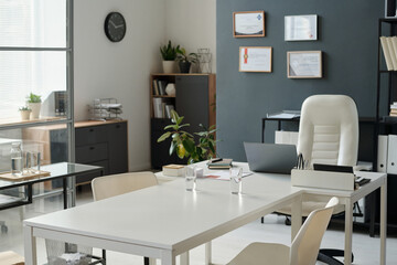 Background image of meeting room in empty office interior in minimal black and white design copy space